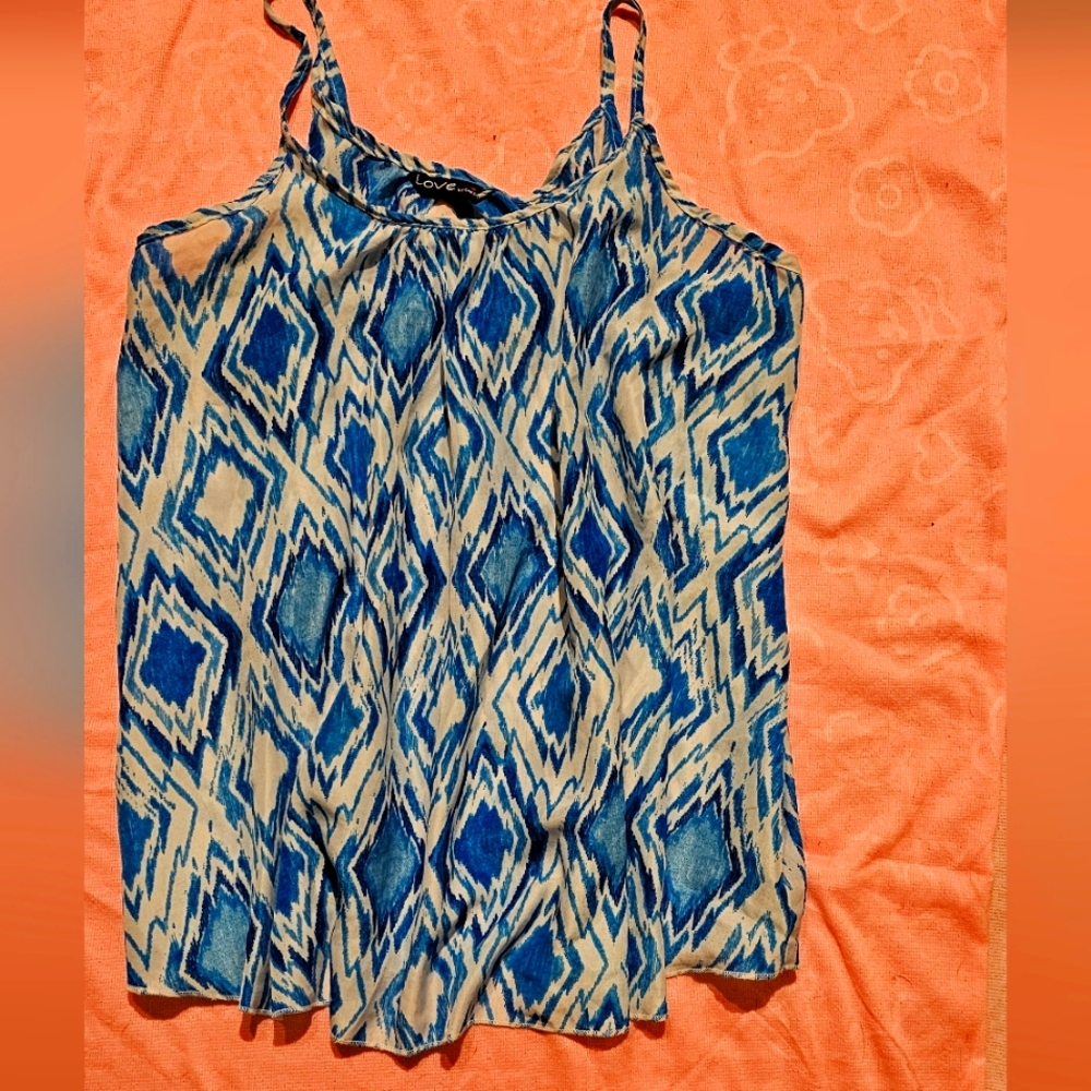 Tank top, blue and white.  High neck, and flairs. Lightweight material medium
